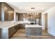 Modern kitchen features stainless steel appliances, a large island, and stylish gray cabinetry at 2177 Garden Ave, Brighton, CO 80601