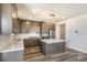 Modern kitchen with stainless steel appliances, center island, and white countertops at 2177 Garden Ave, Brighton, CO 80601