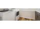 The laundry room features modern, side-by-side appliances and attractive countertops, making chores easier and more stylish at 2177 Garden Ave, Brighton, CO 80601