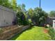 Lush backyard with retaining wall and landscaping, perfect for outdoor living at 19447 E Bellisario Creek Dr, Parker, CO 80134
