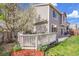 Landscaped backyard featuring a deck area and beautiful plants at 19447 E Bellisario Creek Dr, Parker, CO 80134