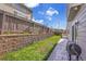 Backyard featuring a patio, lush lawn, and a privacy fence at 19447 E Bellisario Creek Dr, Parker, CO 80134