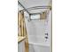 Clean, white tub and shower with tiled walls and modern fixtures at 19447 E Bellisario Creek Dr, Parker, CO 80134