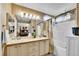 Bright bathroom featuring a double sink vanity and a shower-tub combination at 19447 E Bellisario Creek Dr, Parker, CO 80134