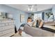 Inviting bedroom with soft colors, a plush bed, and ample natural light at 19447 E Bellisario Creek Dr, Parker, CO 80134