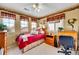 Comfortable bedroom with dual windows providing great natural light and workspace at 19447 E Bellisario Creek Dr, Parker, CO 80134