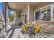 Cozy front porch with outdoor seating, potted plants, and a welcoming atmosphere at 19447 E Bellisario Creek Dr, Parker, CO 80134