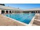A beautiful pool at a community clubhouse with plenty of lounge chairs for residents at 19447 E Bellisario Creek Dr, Parker, CO 80134