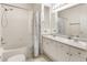 Well-lit bathroom with double sinks, ample counter space, and a shower-tub combo at 3995 S Dillon Way # 102, Aurora, CO 80014