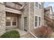 Inviting exterior with stone accents, manicured landscaping, and a charming entryway with ample natural light at 3995 S Dillon Way # 102, Aurora, CO 80014