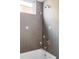 Contemporary bathroom with wood-look tile and shower at 3619 Navajo St, Denver, CO 80211