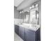 Elegant bathroom with a double vanity and gray cabinets at 3619 Navajo St, Denver, CO 80211