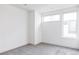Simple bedroom with gray carpet and large windows at 3619 Navajo St, Denver, CO 80211