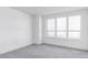 Spacious bedroom with gray carpeting and large windows at 3619 Navajo St, Denver, CO 80211