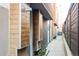 Modern townhome side entrance with unique architectural details and minimalist landscaping at 3619 Navajo St, Denver, CO 80211