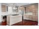Modern kitchen features light wood cabinets, stainless steel appliances, and island cooktop at 3619 Navajo St, Denver, CO 80211