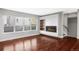 Modern living room with hardwood floors, fireplace, and built-in shelving at 3619 Navajo St, Denver, CO 80211