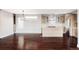 Open-concept space with rich hardwood floors and lots of natural light adjoining a stylish kitchen at 3619 Navajo St, Denver, CO 80211