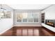 Bright living room with hardwood floors, fireplace, and large windows at 3619 Navajo St, Denver, CO 80211