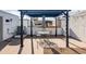 Relaxing rooftop patio with pergola, table, and chairs at 3619 Navajo St, Denver, CO 80211