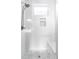 Clean shower with white tiles and a built-in bench at 3619 Navajo St, Denver, CO 80211