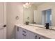 Modern bathroom with a double vanity and quartz countertop at 2951 E Evans Ave, Denver, CO 80210