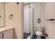 Clean bathroom with a glass shower and blue tile floor at 2951 E Evans Ave, Denver, CO 80210