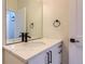 Modern bathroom with a single vanity and quartz countertop at 2951 E Evans Ave, Denver, CO 80210