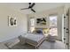 Well-lit bedroom featuring a gray platform bed and window seating at 2951 E Evans Ave, Denver, CO 80210