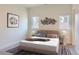 Bright bedroom with a plush bed and modern decor at 2951 E Evans Ave, Denver, CO 80210