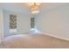 Bright and spacious bedroom with carpeted floor and neutral walls at 2951 E Evans Ave, Denver, CO 80210