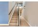 Carpeted hallway with neutral walls and lighting at 2951 E Evans Ave, Denver, CO 80210