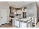 Modern kitchen with white cabinets, stainless steel appliances, and gray tile backsplash at 2951 E Evans Ave, Denver, CO 80210