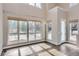 Sun-drenched living room with hardwood floors and large windows at 2951 E Evans Ave, Denver, CO 80210