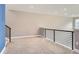 Spacious loft area with carpeted floors and accent wall at 2951 E Evans Ave, Denver, CO 80210