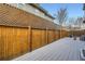 Private backyard with a wooden fence, offering a peaceful outdoor space at 8157 E 53Rd Dr, Denver, CO 80238