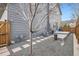 Landscaped backyard featuring gravel, stepping stones, and a small deck area at 8157 E 53Rd Dr, Denver, CO 80238