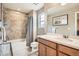 Well-lit bathroom with updated fixtures and a shower-tub combo at 8157 E 53Rd Dr, Denver, CO 80238