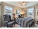Comfortable bedroom with natural light, plush carpets, and tasteful decorations at 8157 E 53Rd Dr, Denver, CO 80238