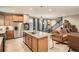 Open kitchen and living area with large island and stainless steel appliances at 8157 E 53Rd Dr, Denver, CO 80238