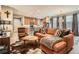 Stylish living room featuring a comfortable sofa and bright, natural light at 8157 E 53Rd Dr, Denver, CO 80238
