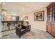 Cozy loft space featuring a comfortable leather chair and decorative furniture accents at 8157 E 53Rd Dr, Denver, CO 80238