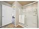 Shower room with full glass doors and white tiling, viewable from bedroom at 443 Hermosa St, Brighton, CO 80603
