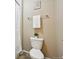 A cozy bathroom featuring a toilet and towel rack at 443 Hermosa St, Brighton, CO 80603