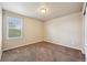 This cozy bedroom has a neutral color scheme and carpet flooring at 443 Hermosa St, Brighton, CO 80603