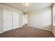 A bright bedroom with a double closet and neutral paint at 443 Hermosa St, Brighton, CO 80603