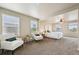 Spacious bedroom with lots of natural light, comfortable seating, and neutral decor at 443 Hermosa St, Brighton, CO 80603