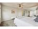 Light and airy main bedroom showcasing a bed, neutral walls, seating and lots of natural light at 443 Hermosa St, Brighton, CO 80603
