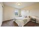 Bedroom with neutral walls, a window providing natural light, and minimal decor at 443 Hermosa St, Brighton, CO 80603