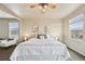 Bright and airy bedroom featuring neutral decor, ceiling fan and windows offering natural light at 443 Hermosa St, Brighton, CO 80603